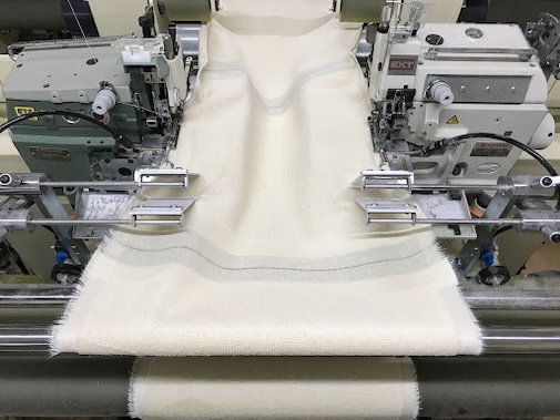 長尺シート両耳自動縫製機（両頭機） イメージ